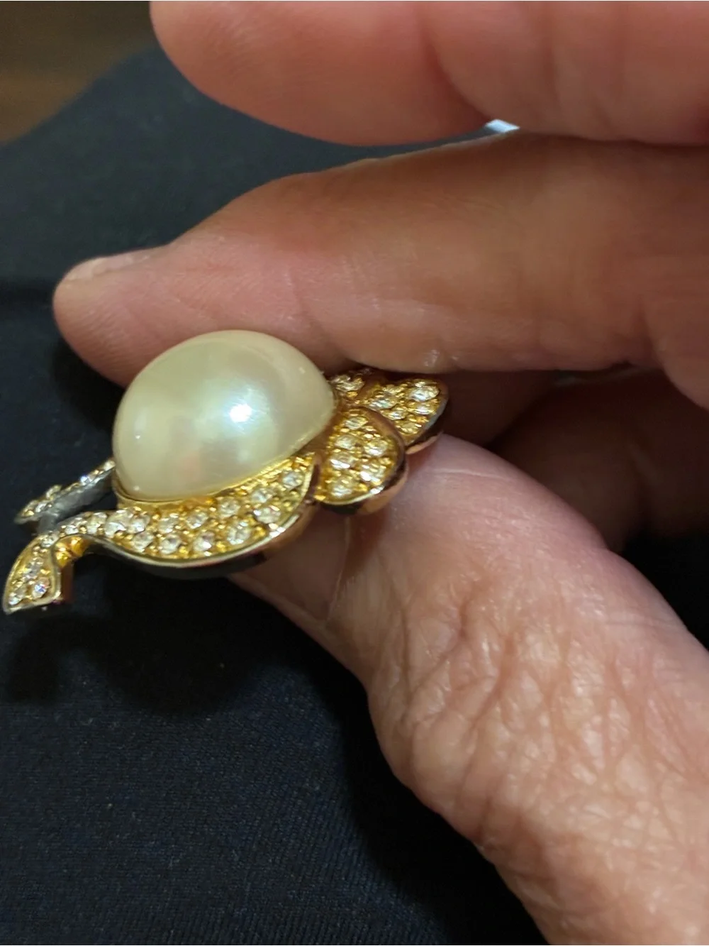 VINTAGE, Nolan Miller, Gold-Tone Faux Pearl Center pendant surrounded Crystals -